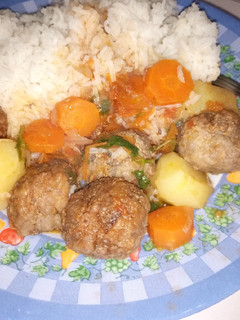 A picture of White rice and meat balls.