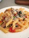 Lamb with blistered cherry tomato, spinach on penne pasta
