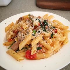 Lamb with blistered cherry tomato, spinach on penne pasta A picture of Lamb with blistered cherry tomato, spinach on penne pasta.