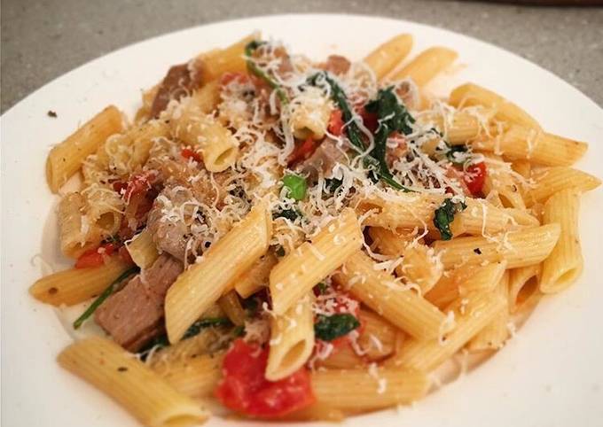 Lamb with blistered cherry tomato, spinach on penne pasta