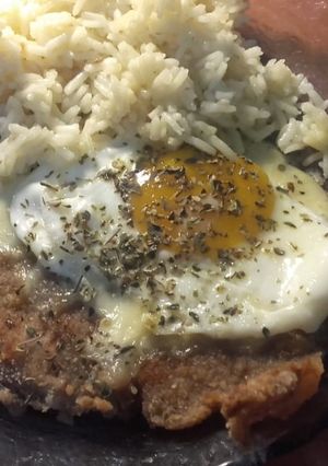Una foto de Mila a caballo con queso y Arroz