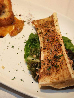 A picture of Bone Marrow and Side Salad.