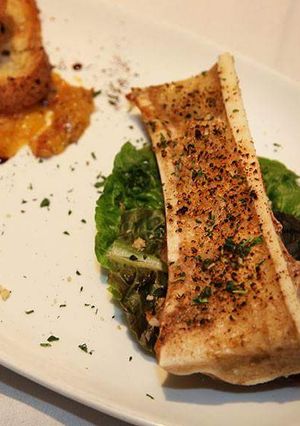 A picture of Bone Marrow and Side Salad.
