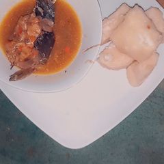 A picture of Boiled yam with catfish pepper soup.