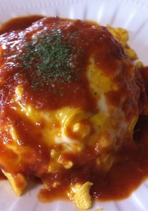A picture of Fluffy Omurice with Tomato Sauce.
