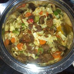 A picture of Vegetable salad with meat.