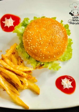 A picture of Chicken shami burger with crunchy fries 😋👌.