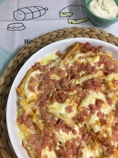 Una foto de Patatas con queso y bacon: patatas Foster´s Hollywood