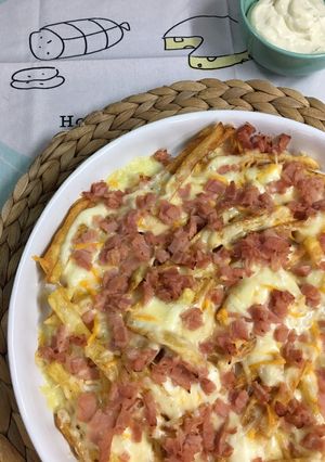 Una foto de Patatas con queso y bacon: patatas Foster´s Hollywood