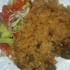 Pilau served with kachimbari A picture of Pilau served with kachimbari.