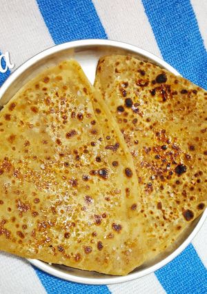 A picture of Sweet Paratha loaded with sugar and milk.
