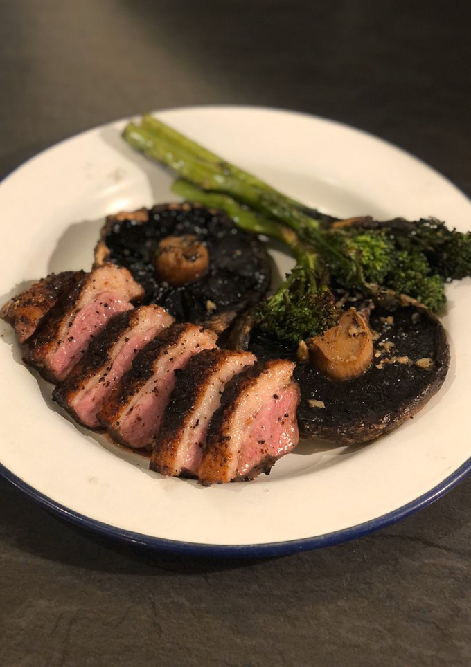 A picture of Duck breast ‘yakitori’ with garlic mushrooms and tender stem broccoli.