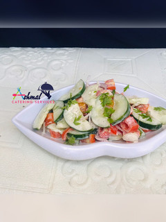 A picture of CREAMY TOMATO & CUCUMBER SALAD.