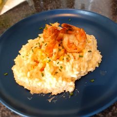 A picture of Risotto with mascarpone, lemon and king prawns.