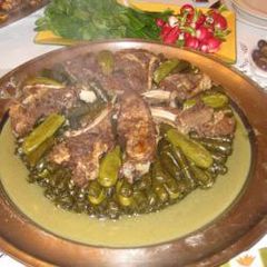A picture of Stuffed vine leaves and zucchini - mehshi warak enab w koussa.