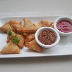 A picture of One bite samosa.