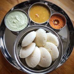 A picture of Fluffy Idli, Chutney,Sambar and idli Podi.