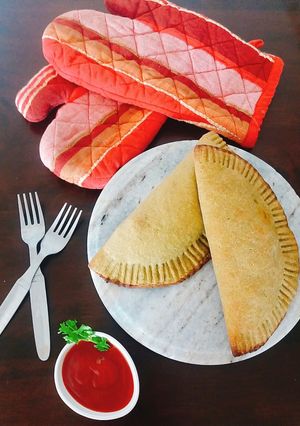 A picture of Spinach Chole Calzone.