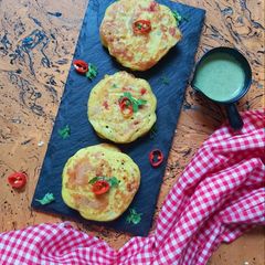 A picture of Masala Uttapams with Mint-Almond chutney.