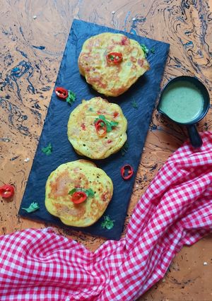 A picture of Masala Uttapams with Mint-Almond chutney.