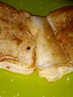 A picture of Fried egg and toasted bread.
