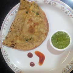 A picture of Paneer cheese parantha with teel chatany.