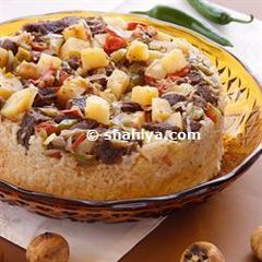 A picture of Mechwi Jader- Upside down rice and vegetable cake.
