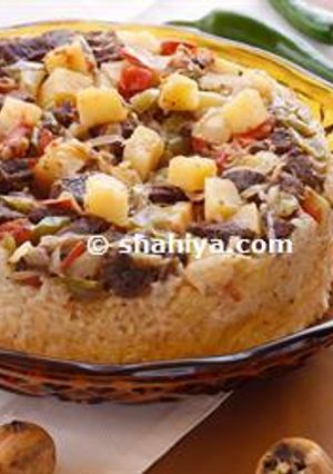 A picture of Mechwi Jader- Upside down rice and vegetable cake.