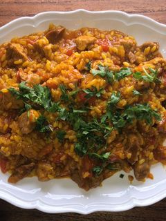Una foto de Arroz meloso de cerdo en olla Cookeo