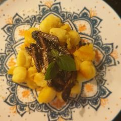 A picture of Gnocchi with wild mushrooms.