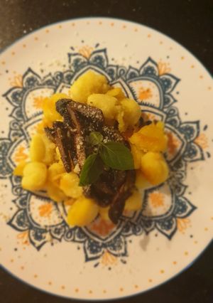 A picture of Gnocchi with wild mushrooms.