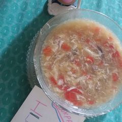 A picture of Chicken noodles corn soup.