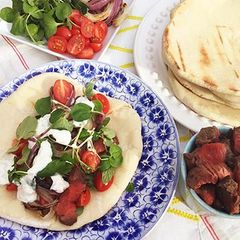 A picture of Fullblood Wagyu Beef Gyros with Tzatziki Sauce.