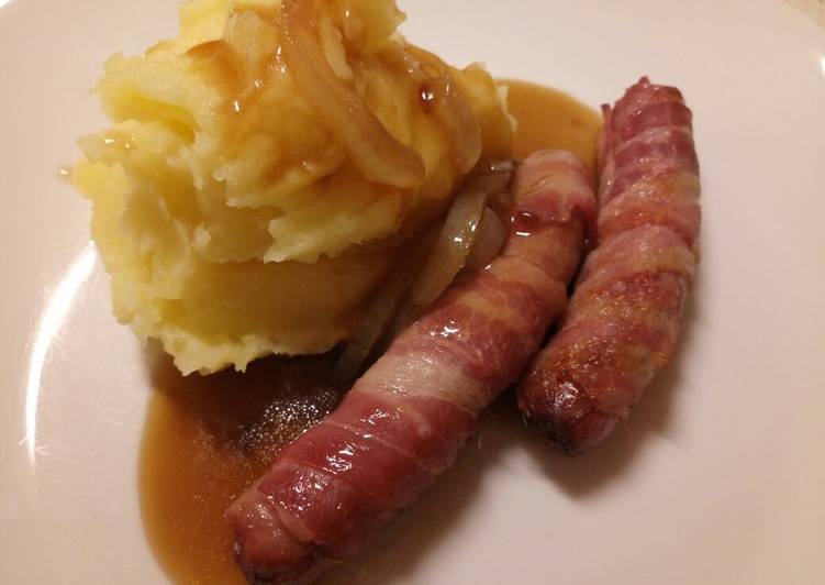Pigs in blankets, mash and onion gravy