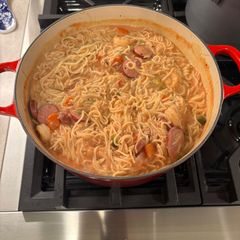 A picture of Turkey Sausage, Chicken Shrimp, with Alfredo/Tomato Sauce Pasta.