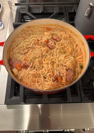 A picture of Turkey Sausage, Chicken Shrimp, with Alfredo/Tomato Sauce Pasta.