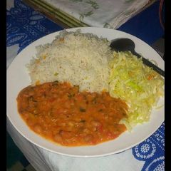 A picture of Vegetable rice, yellow beans and steamed cabbage.