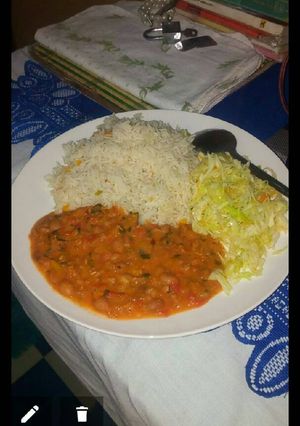 A picture of Vegetable rice, yellow beans and steamed cabbage.