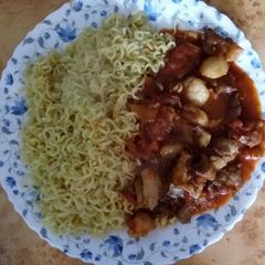 A picture of Mutton stew recipe served with noodles.