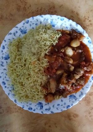 A picture of Mutton stew recipe served with noodles.