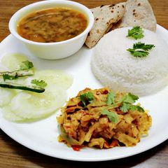 A picture of Healthy dal palak, cabbage sabji,roti,rice and salad.