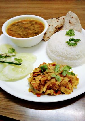 A picture of Healthy dal palak, cabbage sabji,roti,rice and salad.