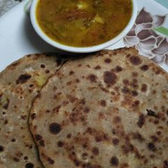 A picture of Aaloo gajar stuff paratha with mix veg. tari.