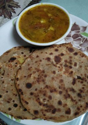 A picture of Aaloo gajar stuff paratha with mix veg. tari.