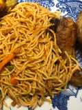 Jollof spaghetti with mince meat and hotdog