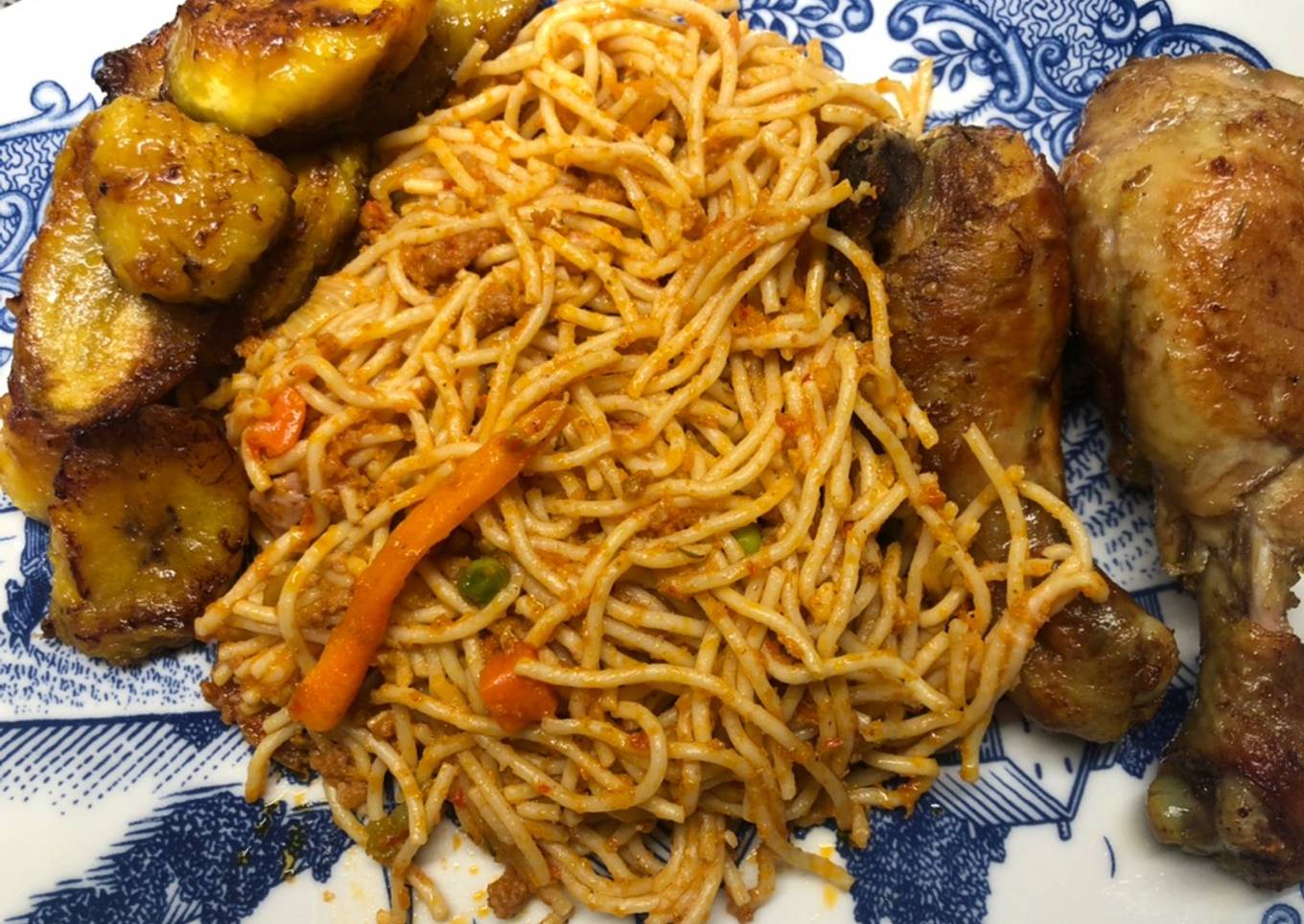 Jollof spaghetti with mince meat and hotdog