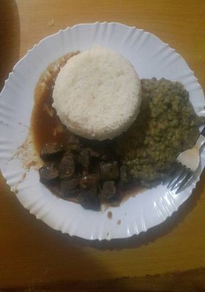 A picture of Maini with rice and ndengu.