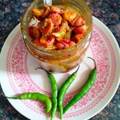 A picture of Karonda and green chilli pickle.