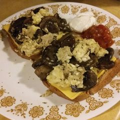 A picture of Mushroom Scrambled Eggs over Toast.