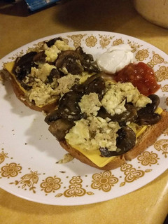 A picture of Mushroom Scrambled Eggs over Toast.